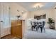 Cozy dining area featuring neutral tones, a round table with chairs, and modern light fixture at 5511 S Lowell Blvd, Littleton, CO 80123