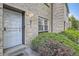 Inviting entrance with brick facade, decorative door, and well-maintained landscaping at 5511 S Lowell Blvd, Littleton, CO 80123