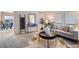 Comfortable living room with a view to the dining room, modern furniture, and natural light at 5511 S Lowell Blvd, Littleton, CO 80123