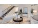 Stylish living room with staircase, modern decor, and a bright and airy feel at 5511 S Lowell Blvd, Littleton, CO 80123