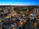 Dusk aerial showcasing the city skyline and the property's location at 1345 N Franklin St, Denver, CO 80218