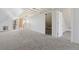 Unfinished attic with kitchenette provides ample storage or living space with carpeting and raftered ceiling at 1345 N Franklin St, Denver, CO 80218