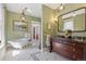Luxurious bathroom featuring a clawfoot tub, custom vanity, and designer fixtures at 1345 N Franklin St, Denver, CO 80218
