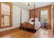 Charming bedroom features a four-poster bed and hardwood floors at 1345 N Franklin St, Denver, CO 80218