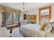 Bright bedroom with large windows, natural trim, and fireplace at 1345 N Franklin St, Denver, CO 80218