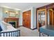 Bedroom includes fireplace, carpet, and outdoor access through french doors at 1345 N Franklin St, Denver, CO 80218