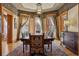 Formal dining room with large windows, a grand table set for ten, and classic woodwork at 1345 N Franklin St, Denver, CO 80218