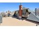 Exterior rooftop view highlighting the house's unique architecture and charming chimney at 1345 N Franklin St, Denver, CO 80218