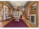 Spacious foyer boasts detailed woodwork, hardwood flooring, and a striking staircase at 1345 N Franklin St, Denver, CO 80218
