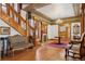 Grand foyer with staircase, fireplace, hardwood floors, and luxurious furnishings at 1345 N Franklin St, Denver, CO 80218