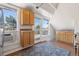 Bright kitchenette boasts wood cabinetry, stainless sink, and outdoor access for easy entertaining and enjoyment at 1345 N Franklin St, Denver, CO 80218