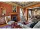 Elegant living room features a fireplace, plush seating, and an open view into the dining area at 1345 N Franklin St, Denver, CO 80218