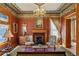 Sophisticated living room with a decorative fireplace, chandelier and classic furnishings at 1345 N Franklin St, Denver, CO 80218