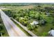 Scenic aerial view of neighborhood with mature trees, lush greenery, and a sprawling landscape at 7313 S Boulder Rd, Boulder, CO 80303