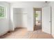 Bright bedroom features an open closet and a window with a pleasant view at 7313 S Boulder Rd, Boulder, CO 80303