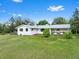 Spacious ranch-style home features a well-manicured lawn and a large backyard perfect for entertaining at 7313 S Boulder Rd, Boulder, CO 80303