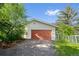 One-car garage is nestled among mature landscaping and features a long driveway at 7313 S Boulder Rd, Boulder, CO 80303