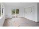 Bright living room area featuring sliding glass doors leading to a deck, bathed in natural light at 7313 S Boulder Rd, Boulder, CO 80303