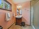 Bathroom with peach walls, a vanity, walk in shower and tile flooring at 10852 Conifer Mountain Rd, Conifer, CO 80433