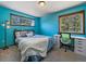 Bedroom featuring blue walls, two large windows, carpet flooring, and modern furniture at 10852 Conifer Mountain Rd, Conifer, CO 80433