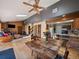 Spacious living room and dining area with natural light and hardwood floors throughout at 10852 Conifer Mountain Rd, Conifer, CO 80433