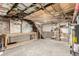 Unfinished basement with exposed ceiling and brick walls, offering plenty of potential at 2705 N Lafayette St, Denver, CO 80205