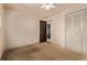 Bedroom featuring closet space and ceiling fan at 1828 Stratford Ln, Longmont, CO 80503