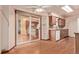 Dining area featuring hardwood floors and sliding glass doors to the exterior at 1828 Stratford Ln, Longmont, CO 80503