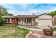 Charming home exterior with brick accents, a cozy front porch, and a well-maintained lawn at 1828 Stratford Ln, Longmont, CO 80503