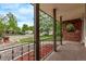 Inviting front porch with brick details and decorative railings and seating area at 1828 Stratford Ln, Longmont, CO 80503