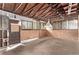 Exposed framing in a spacious garage with natural light at 1828 Stratford Ln, Longmont, CO 80503