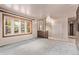Bright living room featuring neutral walls, and a large window at 1828 Stratford Ln, Longmont, CO 80503