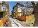 Contemporary two-story home with modern brick and siding and a well manicured yard in a suburban neighborhood at 822 Fairfax St, Denver, CO 80220