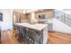 Spacious kitchen features a large island with seating, modern appliances, and stylish cabinetry for a contemporary feel at 822 Fairfax St, Denver, CO 80220