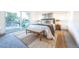 Serene main bedroom with large windows, stylish decor, and a cozy seating area at 822 Fairfax St, Denver, CO 80220