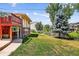 Well-maintained backyard features lush lawn and mature trees creating a peaceful outdoor space at 8165 W Stene Dr, Littleton, CO 80128
