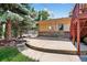 Features a cozy outdoor space with a patio and backyard access, perfect for relaxation and entertainment at 8165 W Stene Dr, Littleton, CO 80128