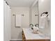 Bathroom featuring double sink vanity with marbled countertop and decorative flowers at 8165 W Stene Dr, Littleton, CO 80128