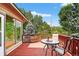 Relaxing deck with outdoor seating surrounded by lush greenery; perfect for enjoying the outdoors at 8165 W Stene Dr, Littleton, CO 80128