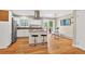 Bright kitchen featuring an island with bar seating, and stainless steel appliances at 8165 W Stene Dr, Littleton, CO 80128