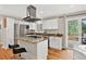 Well-equipped kitchen with stainless steel appliances and a center island cooktop at 8165 W Stene Dr, Littleton, CO 80128