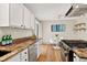 Modern kitchen features granite countertops and white cabinets at 8165 W Stene Dr, Littleton, CO 80128