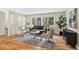 Sun-drenched living room with hardwood flooring and a neutral color palette at 8165 W Stene Dr, Littleton, CO 80128
