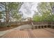Backyard deck with seating and views of landscaped yard with privacy fence at 10729 Kipling Way, Broomfield, CO 80021