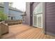 Relaxing backyard deck with built in seating, and access to large windowed door at 10729 Kipling Way, Broomfield, CO 80021