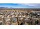 Panoramic aerial view of a neighborhood with tree-lined streets and mountain views at 10722 W 54Th Pl, Arvada, CO 80002