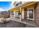 Inviting front porch with decorative railing and a cozy entrance, enhanced by stone accents at 10722 W 54Th Pl, Arvada, CO 80002