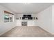 Bright and airy living room featuring a fireplace, built-in shelving, and a large window at 10722 W 54Th Pl, Arvada, CO 80002