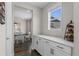 White cabinetry and quartz countertops in butlers pantry at 11633 Norfolk St, Commerce City, CO 80022