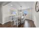 Bright dining room with hardwood floors and a large dining table at 11633 Norfolk St, Commerce City, CO 80022